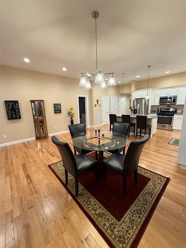 Dining room, Interior, Kitchen, Pendant Lights, Recessed Lighting, Stainless Steel Appliances, Wood Texture Flooring