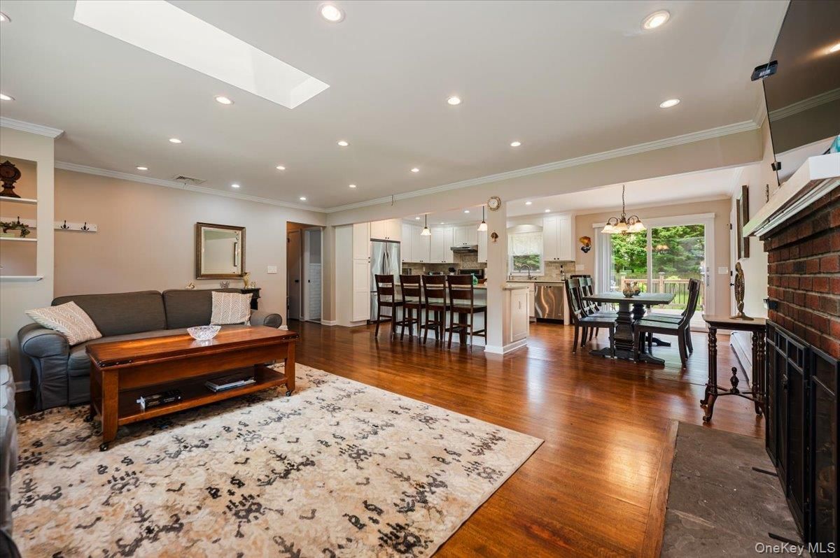 Chandelier, Dining room, Fireplace, Interior, Kitchen, Pendant Lights, Recessed Lighting, Stone Walls, Wood Texture Flooring