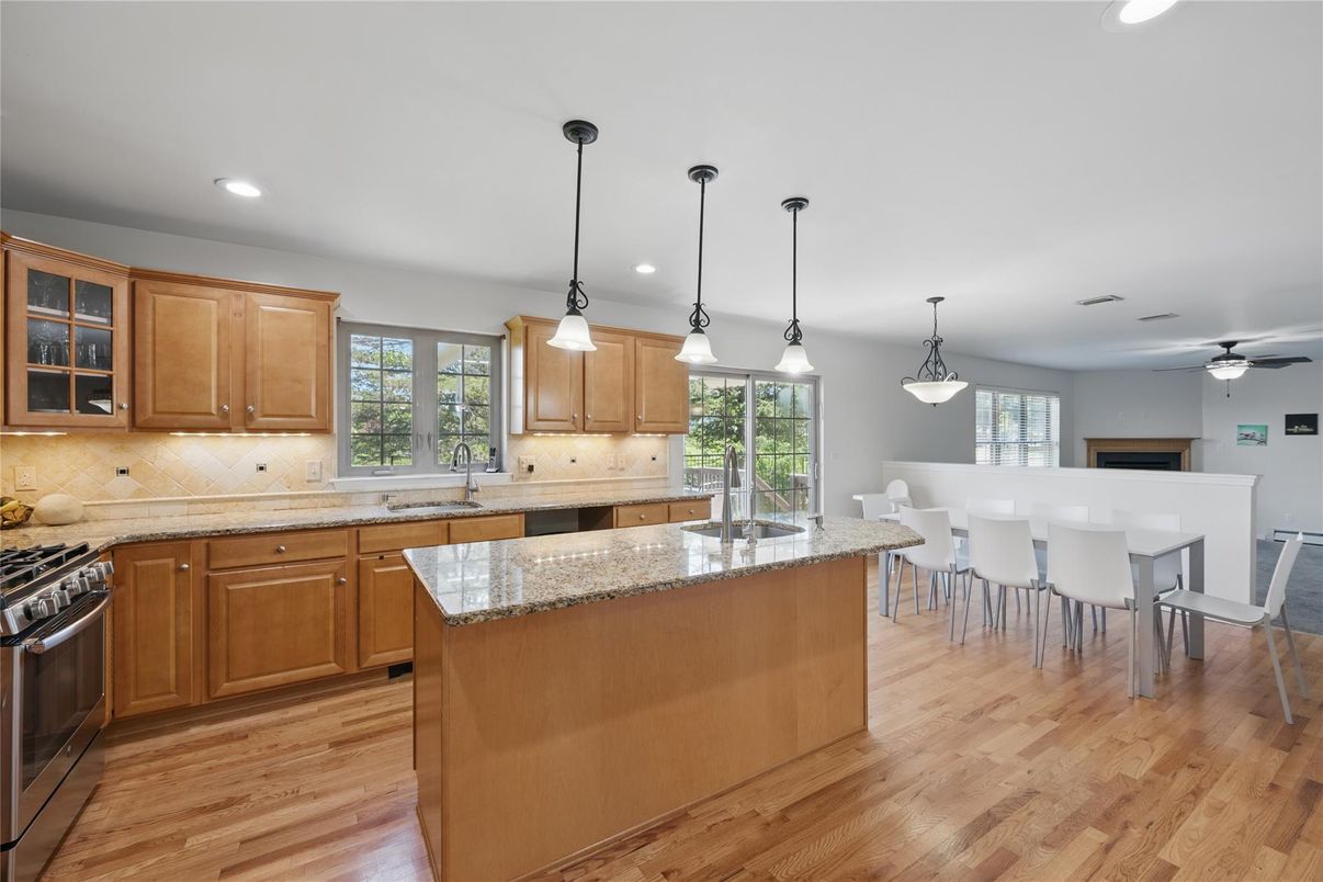 Dining room, Interior, Kitchen, Pendant Lights, Recessed Lighting, Stainless Steel Appliances, Wood Texture Flooring