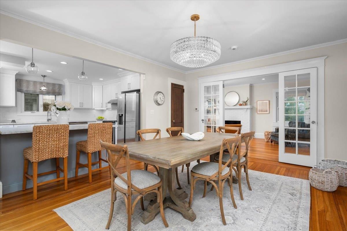 Chandelier, Dining room, Fireplace, Interior, Kitchen, Pendant Lights, Recessed Lighting, Stainless Steel Appliances, Wood Texture Flooring