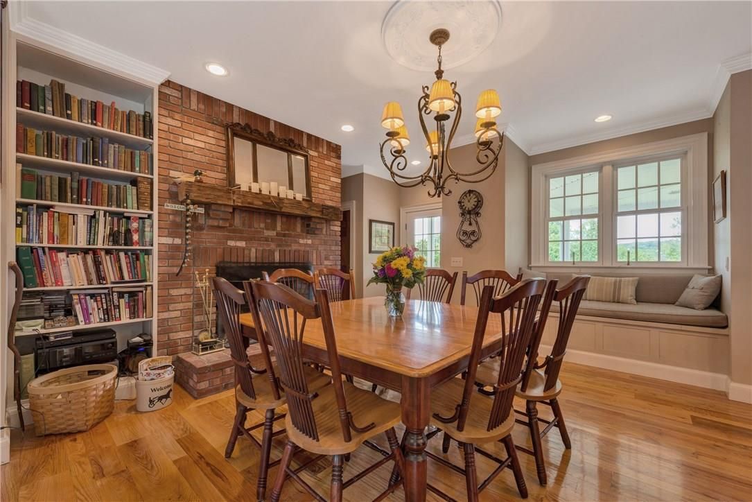 Chandelier, Dining room, Fireplace, Interior, Recessed Lighting, Stone Walls, Wood Texture Flooring