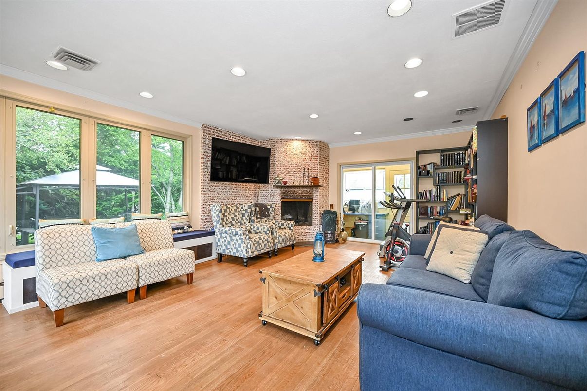 Fireplace, Fitness Equipment, Interior, Living room, Recessed Lighting, Stone Walls, Wood Texture Flooring
