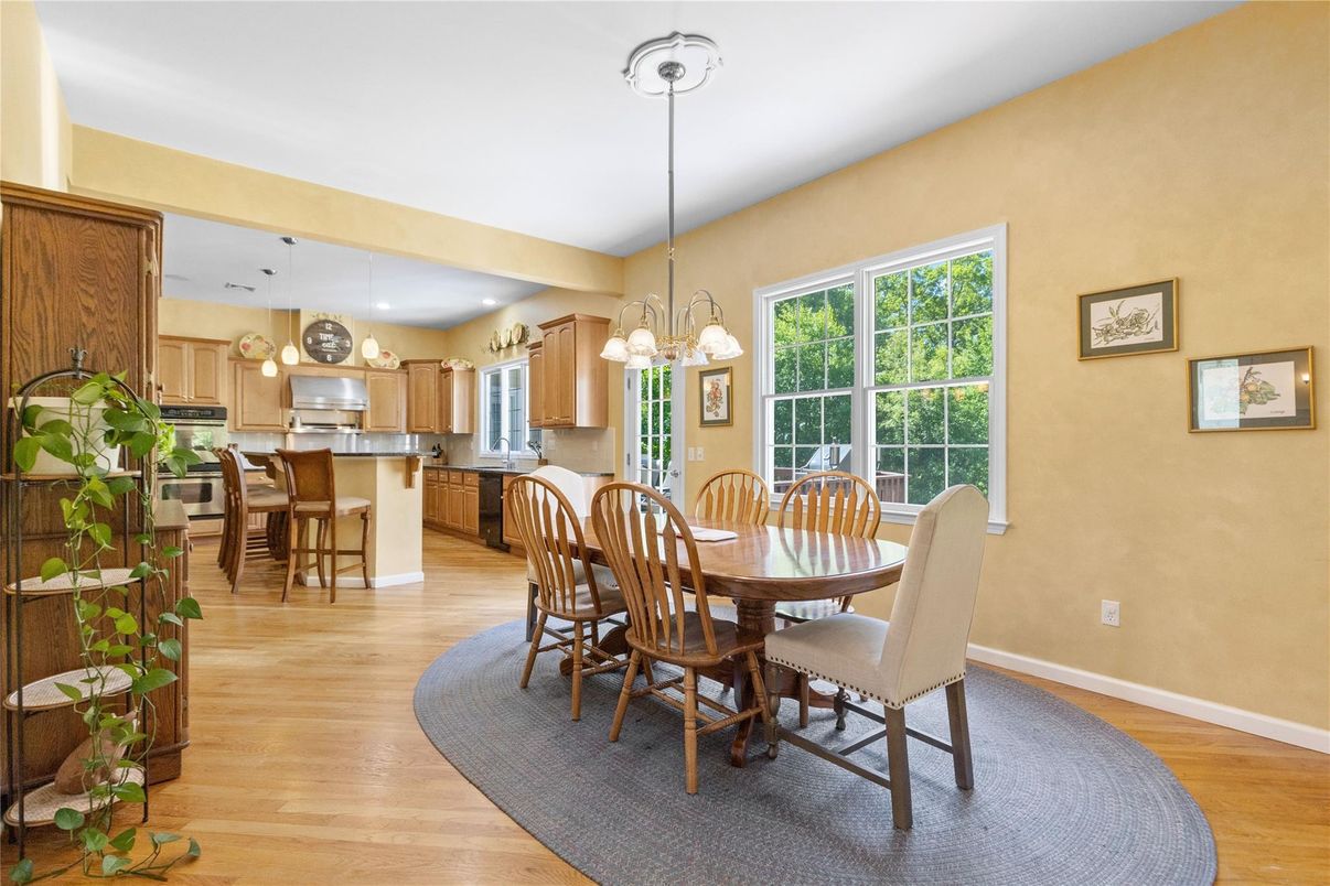 Chandelier, Dining room, Interior, Kitchen, Pendant Lights, Recessed Lighting, Stainless Steel Appliances, Wood Texture Flooring