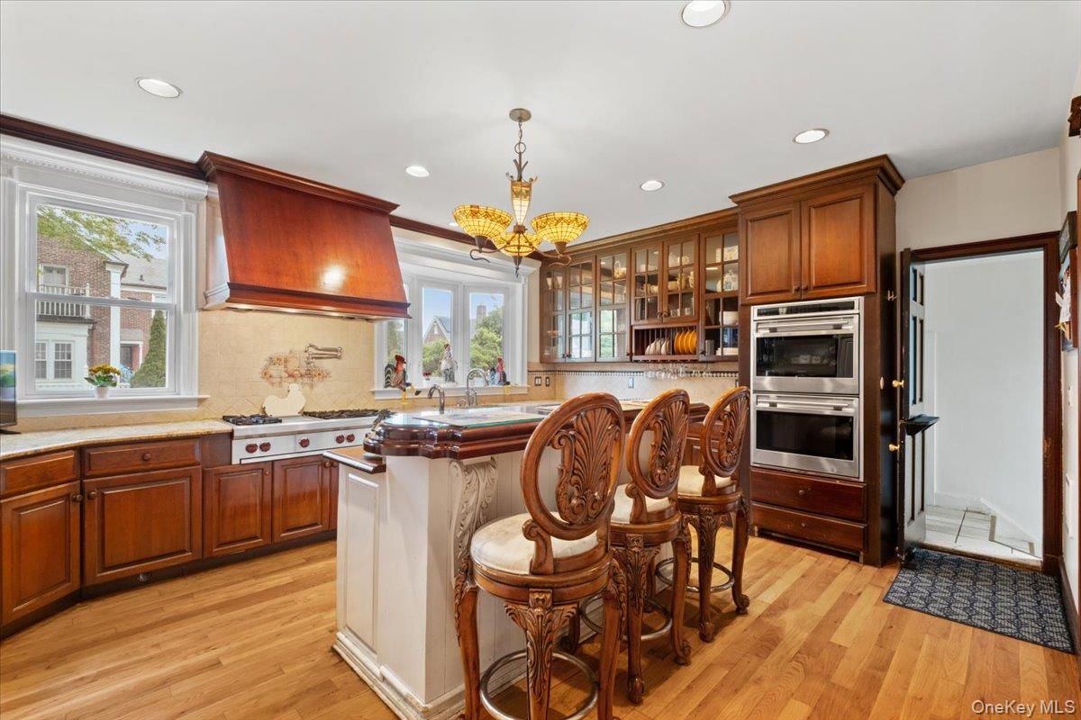 Chandelier, Interior, Kitchen, Pendant Lights, Recessed Lighting, Stainless Steel Appliances, Wood Texture Flooring