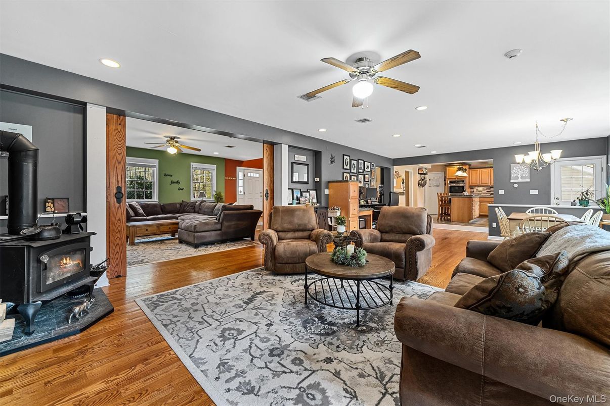 Chandelier, Dining room, Fireplace, Interior, Living room, Recessed Lighting, Wood Texture Flooring