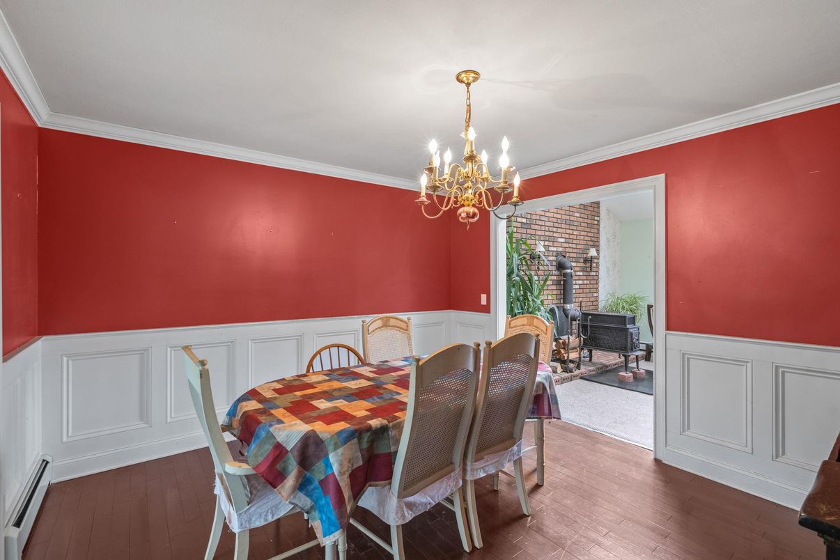 Chandelier, Dining room, Fireplace, Interior, Stone Walls, Wood Texture Flooring