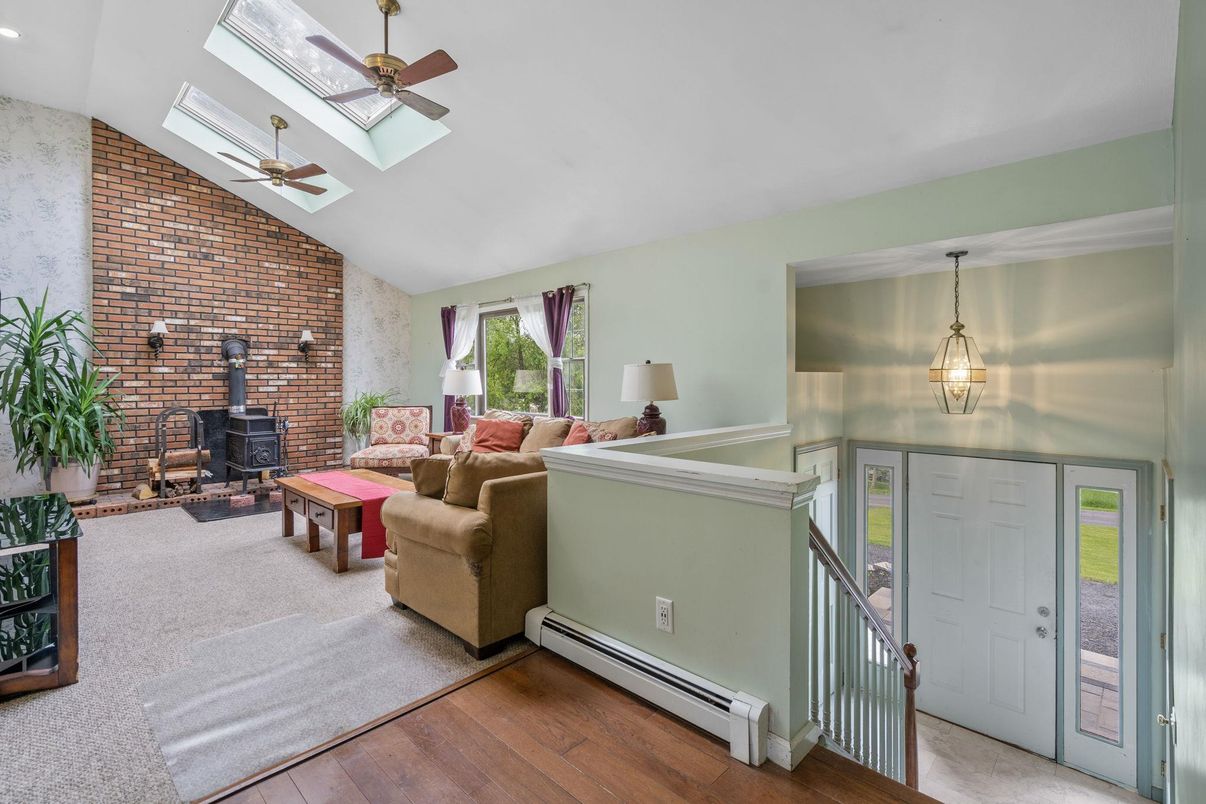 Fireplace, Interior, Living room, Pendant Lights, Recessed Lighting, Stone Walls, Wood Texture Flooring