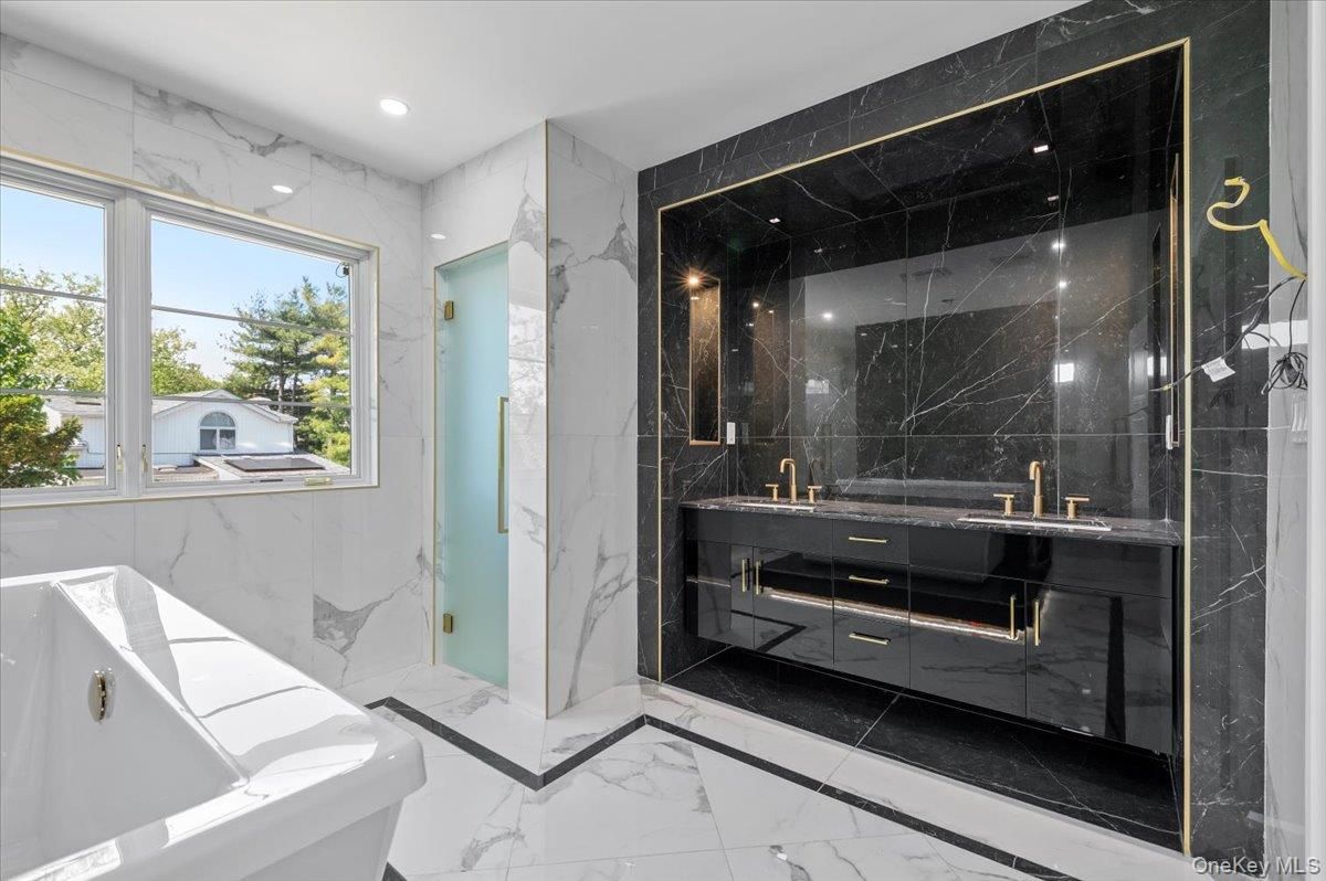 Bathroom, Dual Sink Vanities, Glass Shower, Interior, Marble, Marble Walls, Recessed Lighting