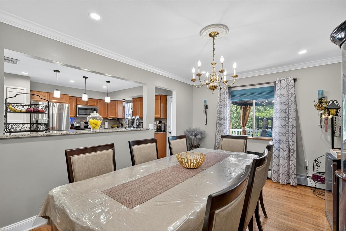 Chandelier, Dining room, Interior, Kitchen, Pendant Lights, Recessed Lighting, Stainless Steel Appliances, Wood Texture Flooring