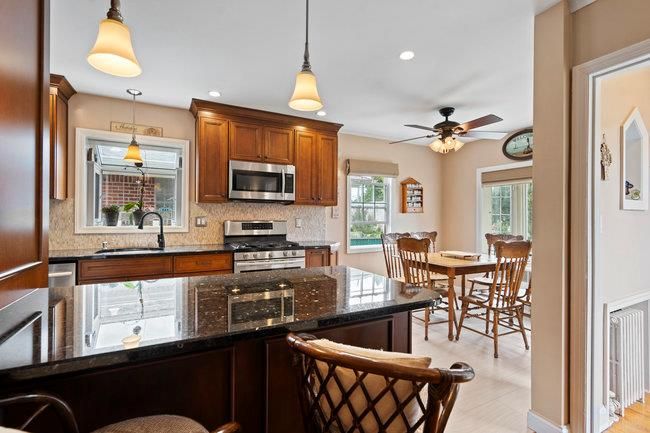 Dining room, Interior, Kitchen, Pendant Lights, Recessed Lighting, Stainless Steel Appliances, Wood Texture Flooring