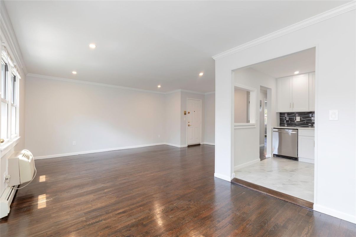 Empty room, Interior, Kitchen, Marble, Recessed Lighting, Stainless Steel Appliances, Wood Texture Flooring