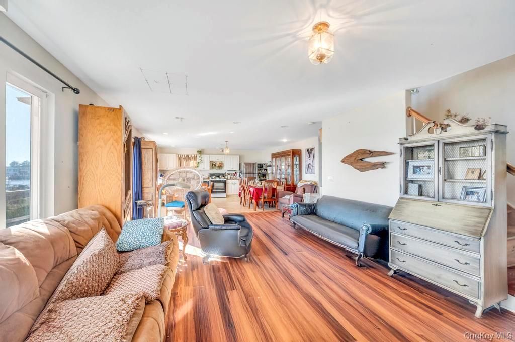 Dining room, Interior, Kitchen, Living room, Recessed Lighting, Stainless Steel Appliances, Wood Texture Flooring