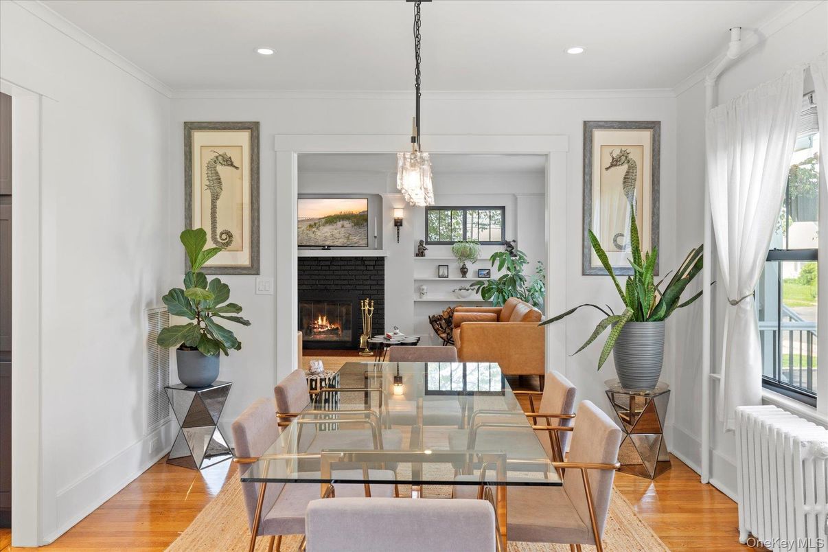 Dining room, Fireplace, Interior, Living room, Pendant Lights, Recessed Lighting, Wood Texture Flooring