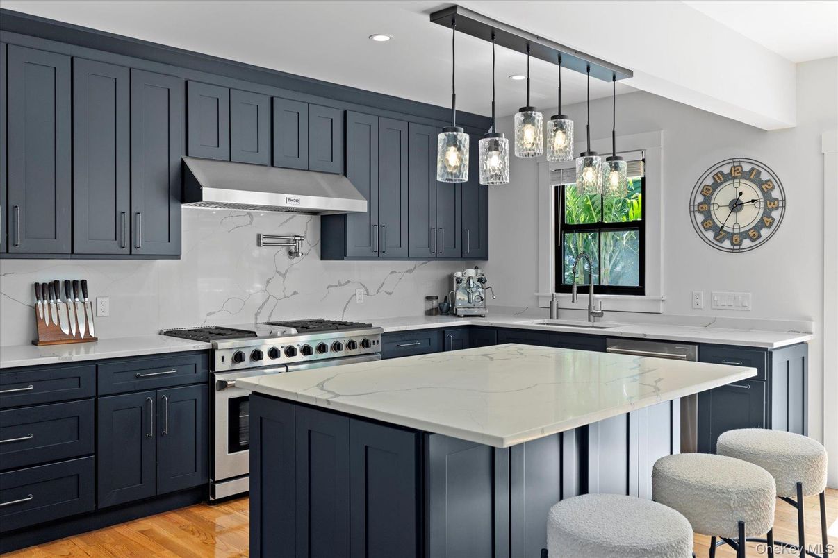 Interior, Kitchen, Marble Walls, Pendant Lights, Recessed Lighting, Stainless Steel Appliances, Wood Texture Flooring