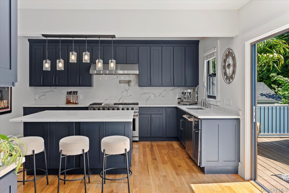 Interior, Kitchen, Marble Walls, Pendant Lights, Stainless Steel Appliances, Wood Texture Flooring