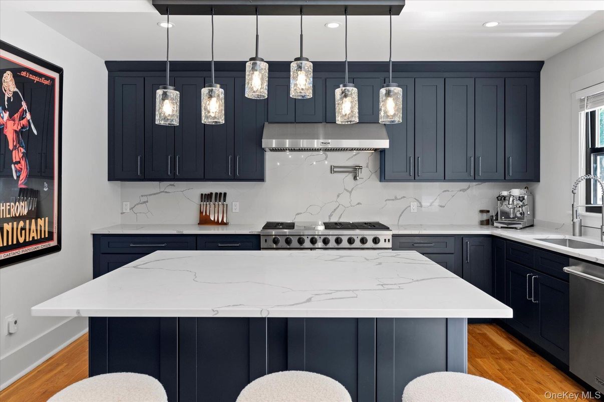 Interior, Kitchen, Marble Walls, Pendant Lights, Recessed Lighting, Stainless Steel Appliances, Wood Texture Flooring