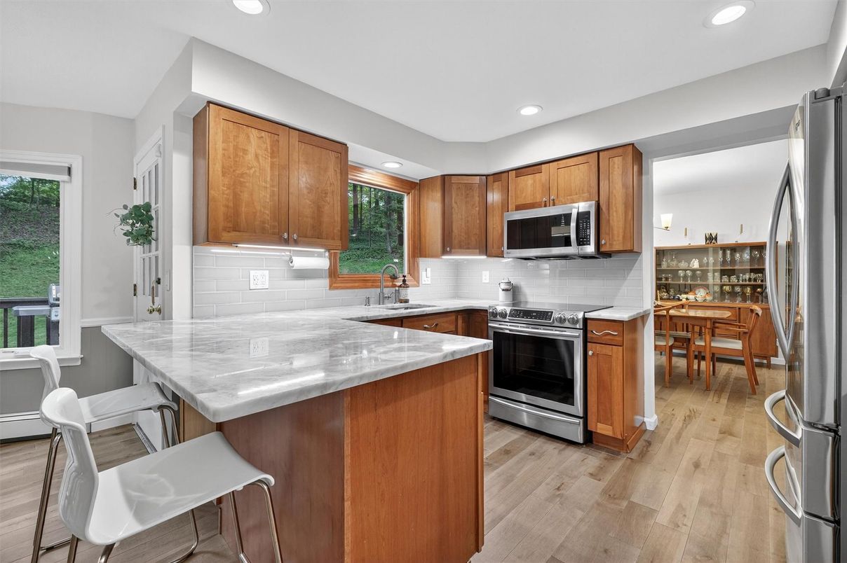 Dining room, Interior, Kitchen, Recessed Lighting, Stainless Steel Appliances, Wood Texture Flooring