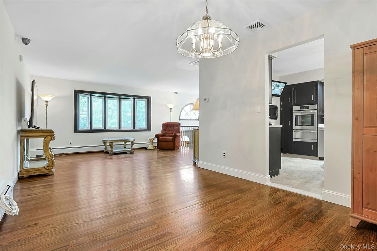 Chandelier, Empty room, Interior, Kitchen, Pendant Lights, Stainless Steel Appliances, Wood Texture Flooring