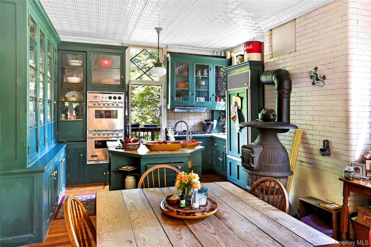 Dining room, Interior, Kitchen, Pendant Lights, Stainless Steel Appliances, Stone Walls, Wood Texture Flooring