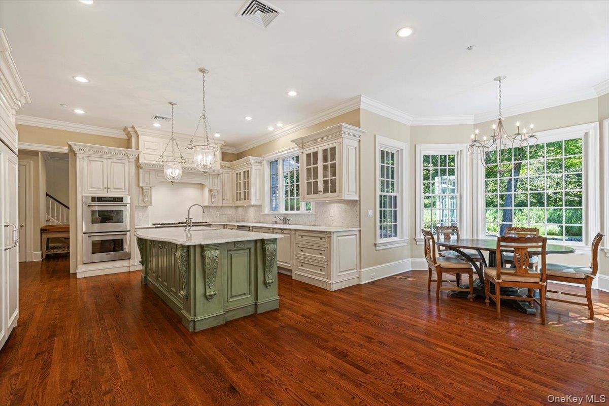 Chandelier, Dining room, Interior, Kitchen, Pendant Lights, Recessed Lighting, Stainless Steel Appliances, Wood Texture Flooring