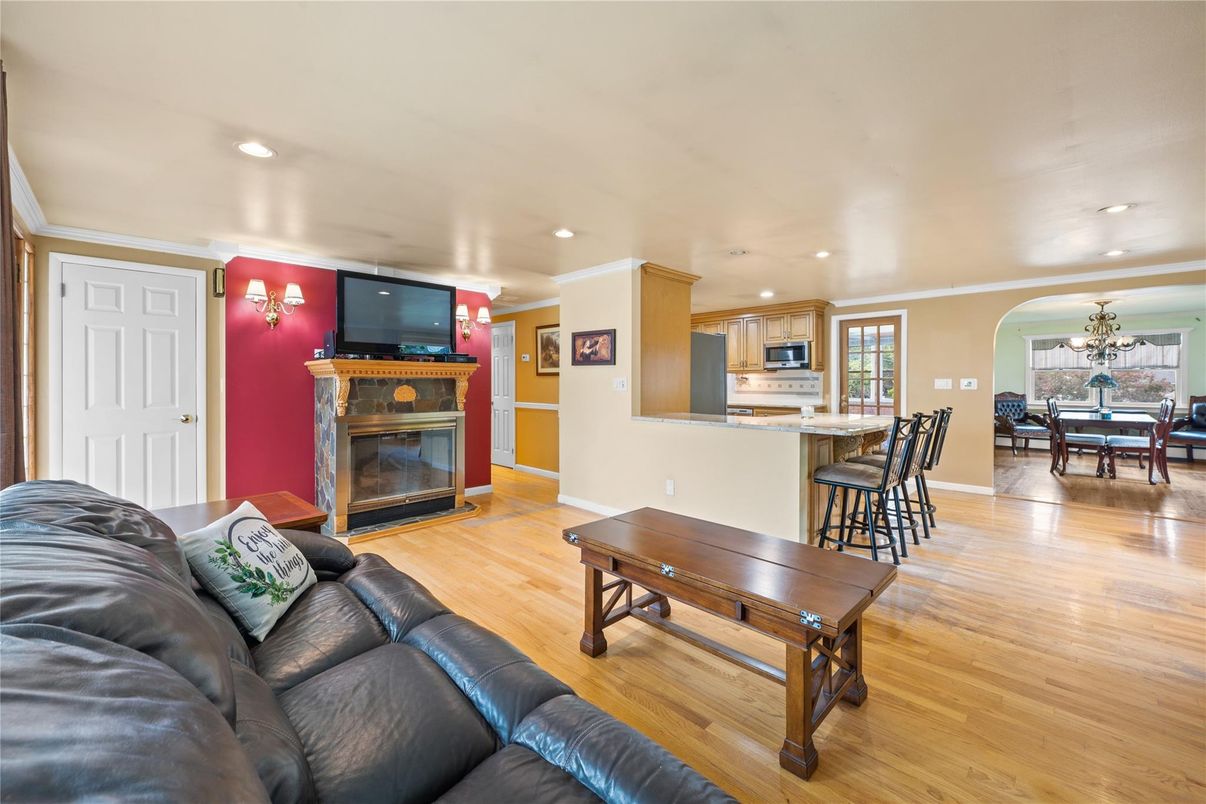 Chandelier, Dining room, Fireplace, Interior, Kitchen, Living room, Recessed Lighting, Wood Texture Flooring