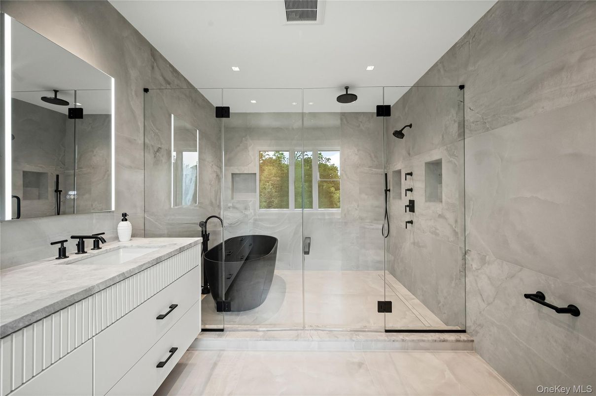 Bathroom, Dual Sink Vanities, Glass Shower, Interior, Marble Walls, Recessed Lighting