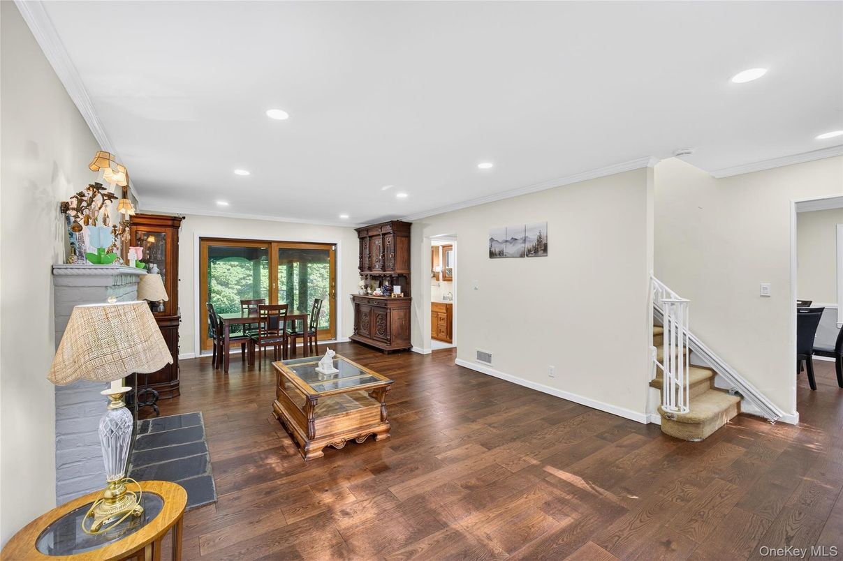 Dining room, Fireplace, Interior, Living room, Recessed Lighting, Wood Texture Flooring