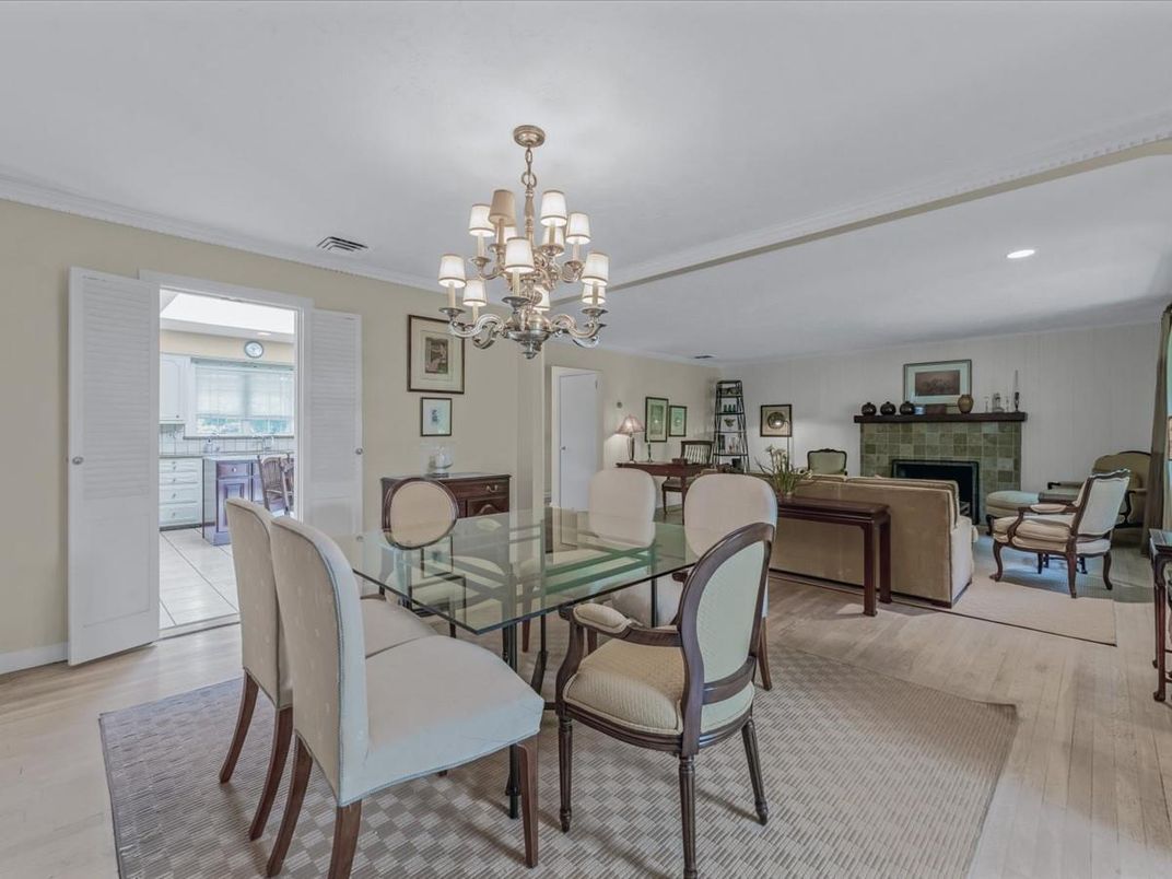 Chandelier, Dining room, Fireplace, Interior, Living room, Recessed Lighting, Wood Texture Flooring