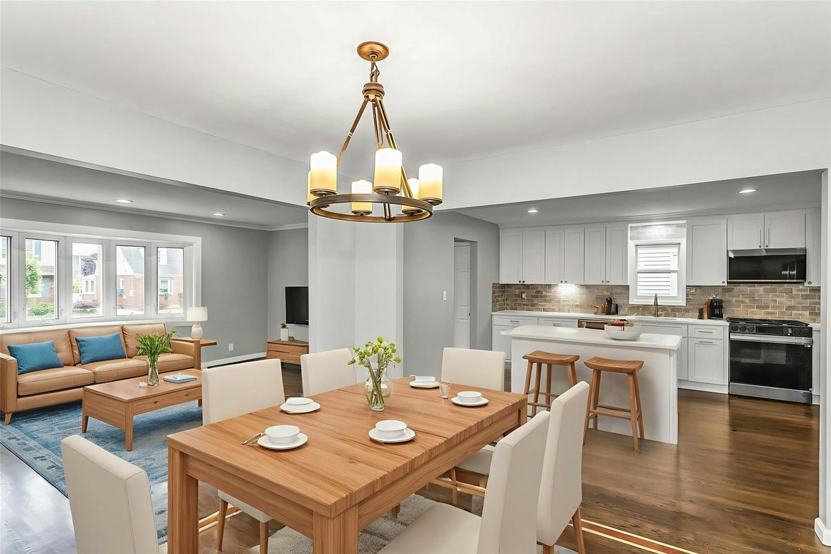 Chandelier, Dining room, Interior, Kitchen, Living room, Pendant Lights, Recessed Lighting, Stainless Steel Appliances, Wood Texture Flooring