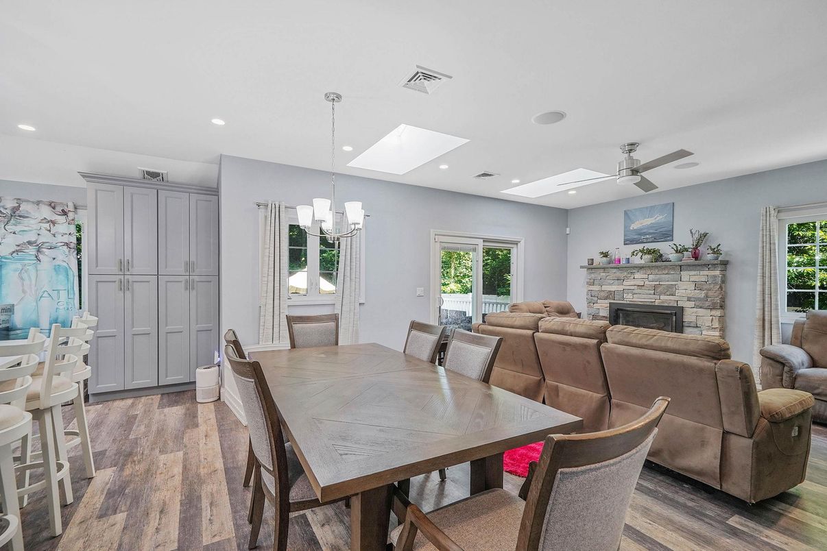 Dining room, Fireplace, Interior, Living room, Pendant Lights, Recessed Lighting, Wood Texture Flooring