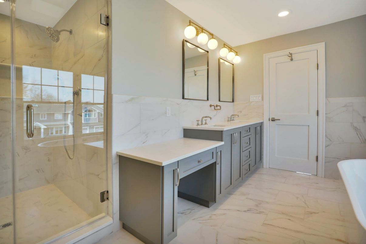Bathroom, Dual Sink Vanities, Glass Shower, Interior, Marble, Marble Walls, Recessed Lighting