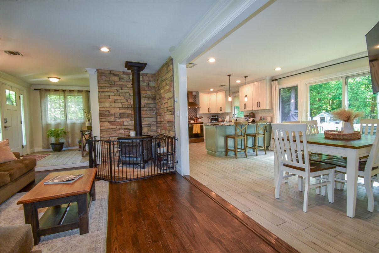 Dining room, Fireplace, Interior, Kitchen, Living room, Pendant Lights, Recessed Lighting, Stone Walls, Wood Texture Flooring