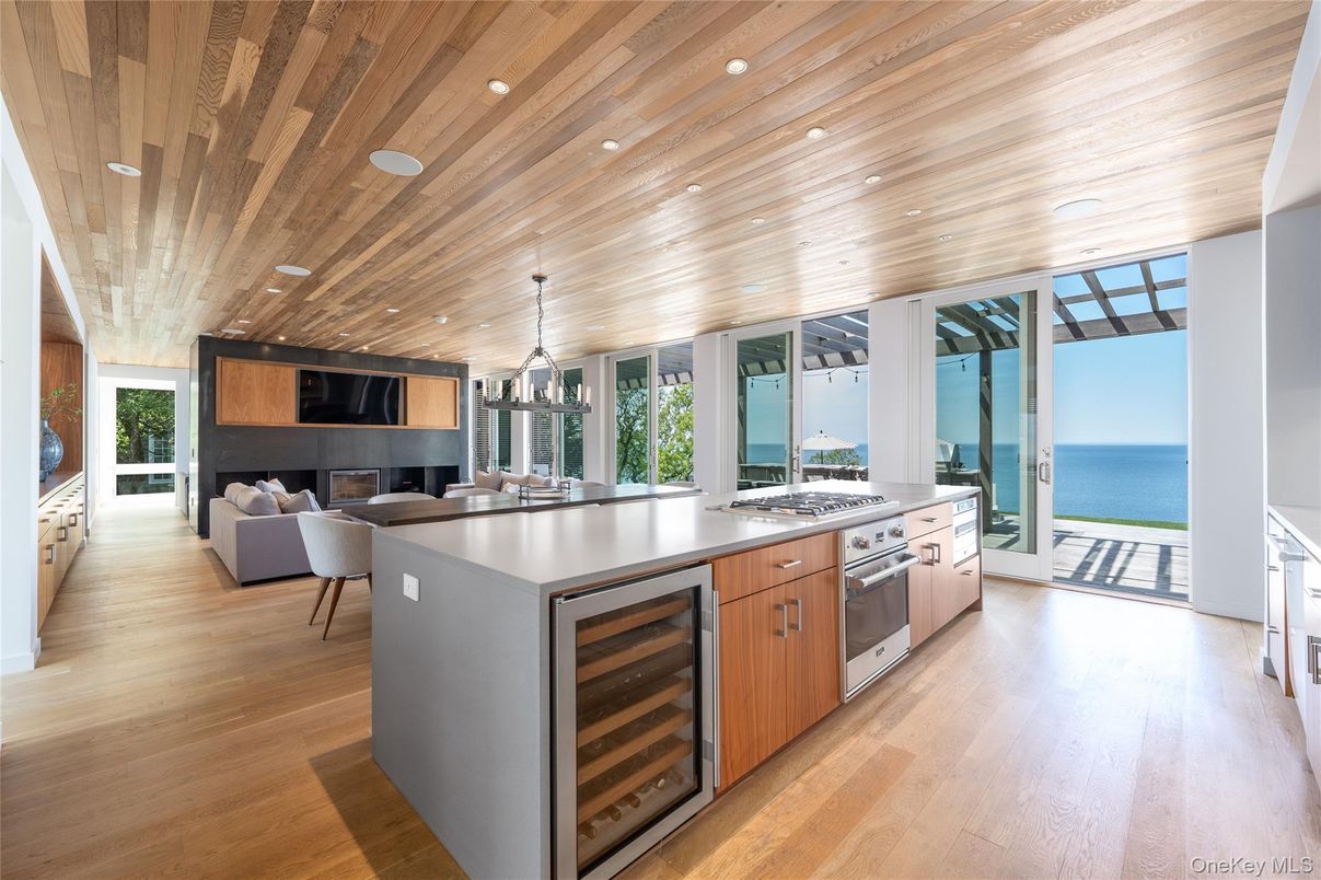 Dining room, Fireplace, Interior, Kitchen, Living room, Pendant Lights, Recessed Lighting, Stainless Steel Appliances, Water, Wooden Ceilings, Wood Texture Flooring