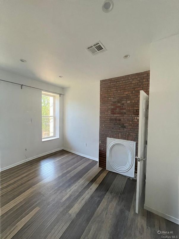 Empty room, Fireplace, Interior, Recessed Lighting, Stone Walls, Wood Texture Flooring