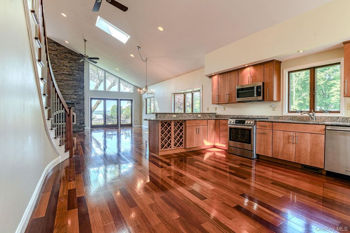 Chandelier, Interior, Kitchen, Recessed Lighting, Stainless Steel Appliances, Stone Walls, Wood Texture Flooring