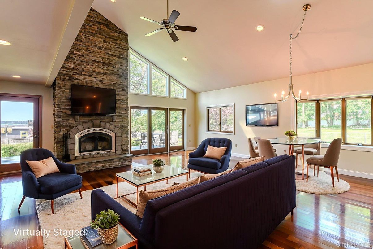 Chandelier, Dining room, Fireplace, Interior, Living room, Recessed Lighting, Stone Walls, Wood Texture Flooring