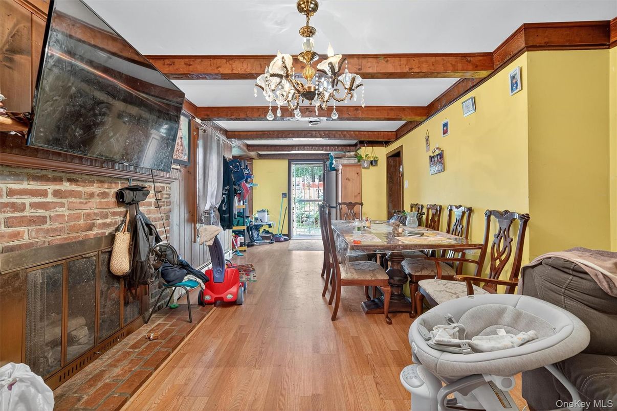 Chandelier, Dining room, Fireplace, Interior, Stone Walls, Wooden Beams, Wood Texture Flooring