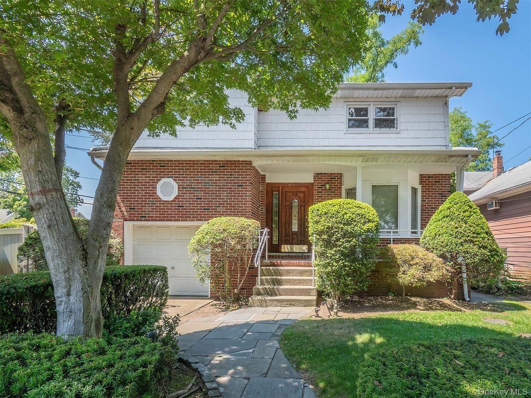 Attached, Exterior, Facade, Brick Facade, American Foursquare
