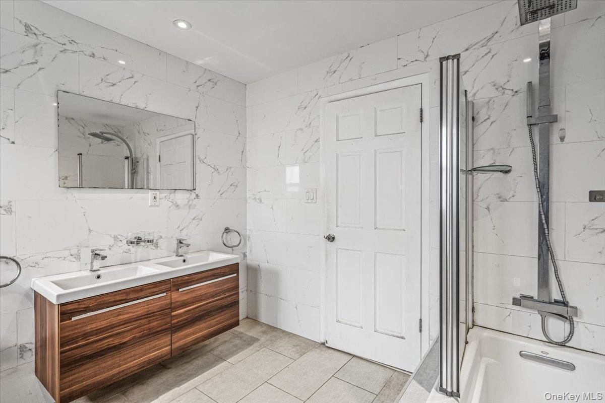 Bathroom, Dual Sink Vanities, Interior, Marble Walls, Recessed Lighting