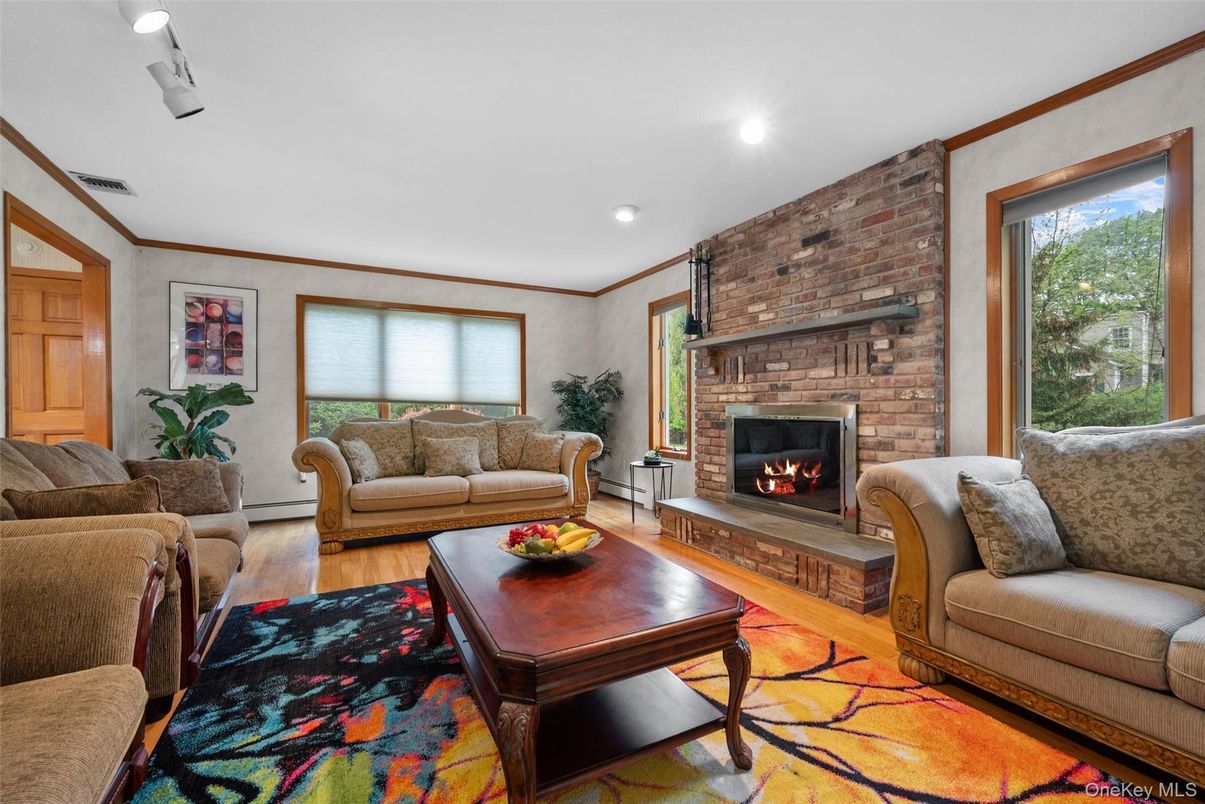 Fireplace, Interior, Living room, Recessed Lighting, Stone Walls, Wood Texture Flooring