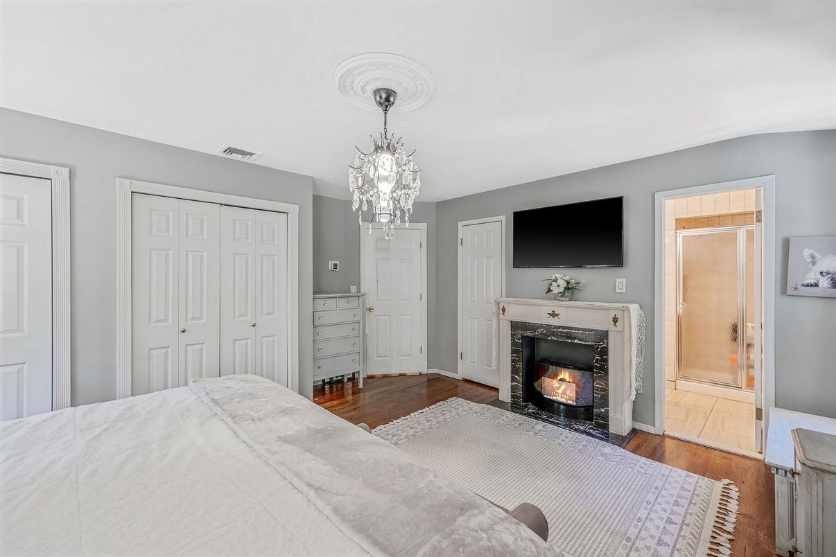 Bedroom, Chandelier, Fireplace, Interior, Wood Texture Flooring