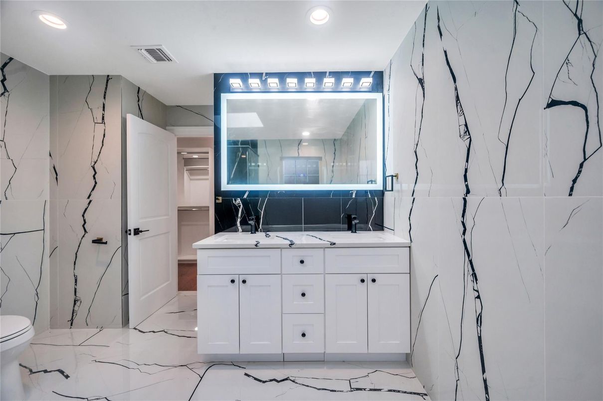 Bathroom, Dual Sink Vanities, Interior, Marble, Marble Walls, Recessed Lighting