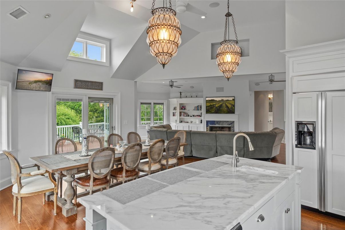 Chandelier, Dining room, Fireplace, Interior, Kitchen, Recessed Lighting, Wood Texture Flooring