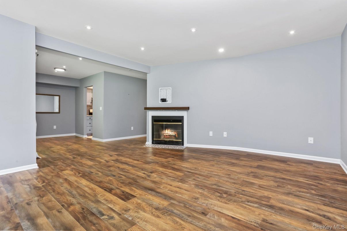 Empty room, Fireplace, Interior, Recessed Lighting, Wood Texture Flooring