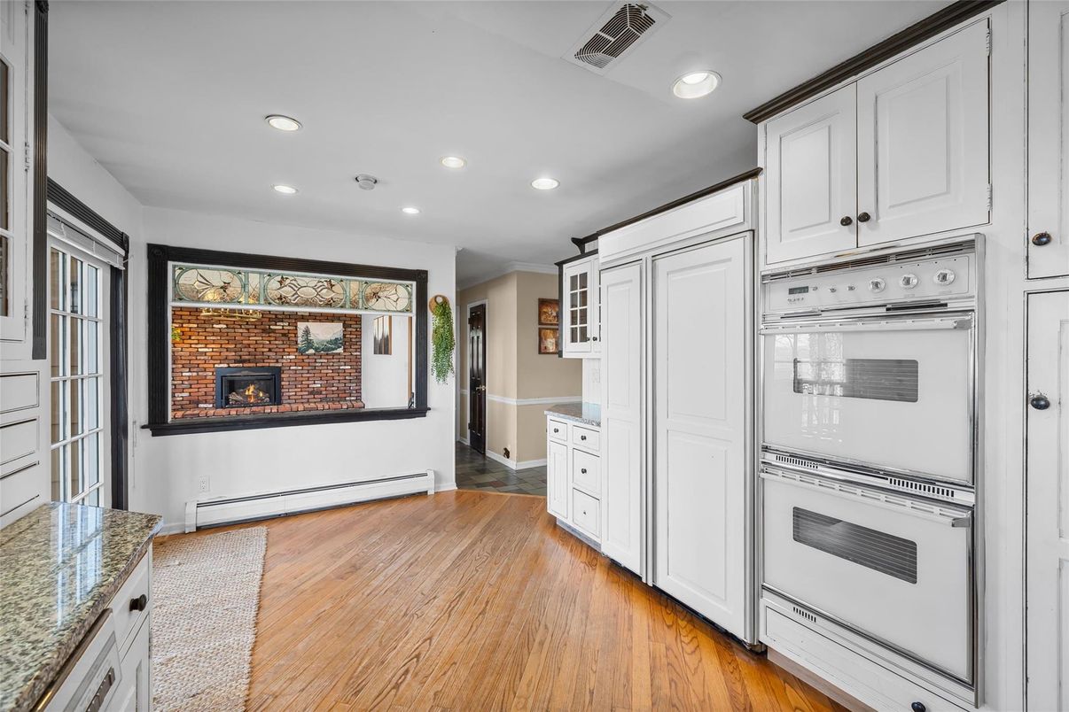 Fireplace, Interior, Kitchen, Recessed Lighting, Wood Texture Flooring