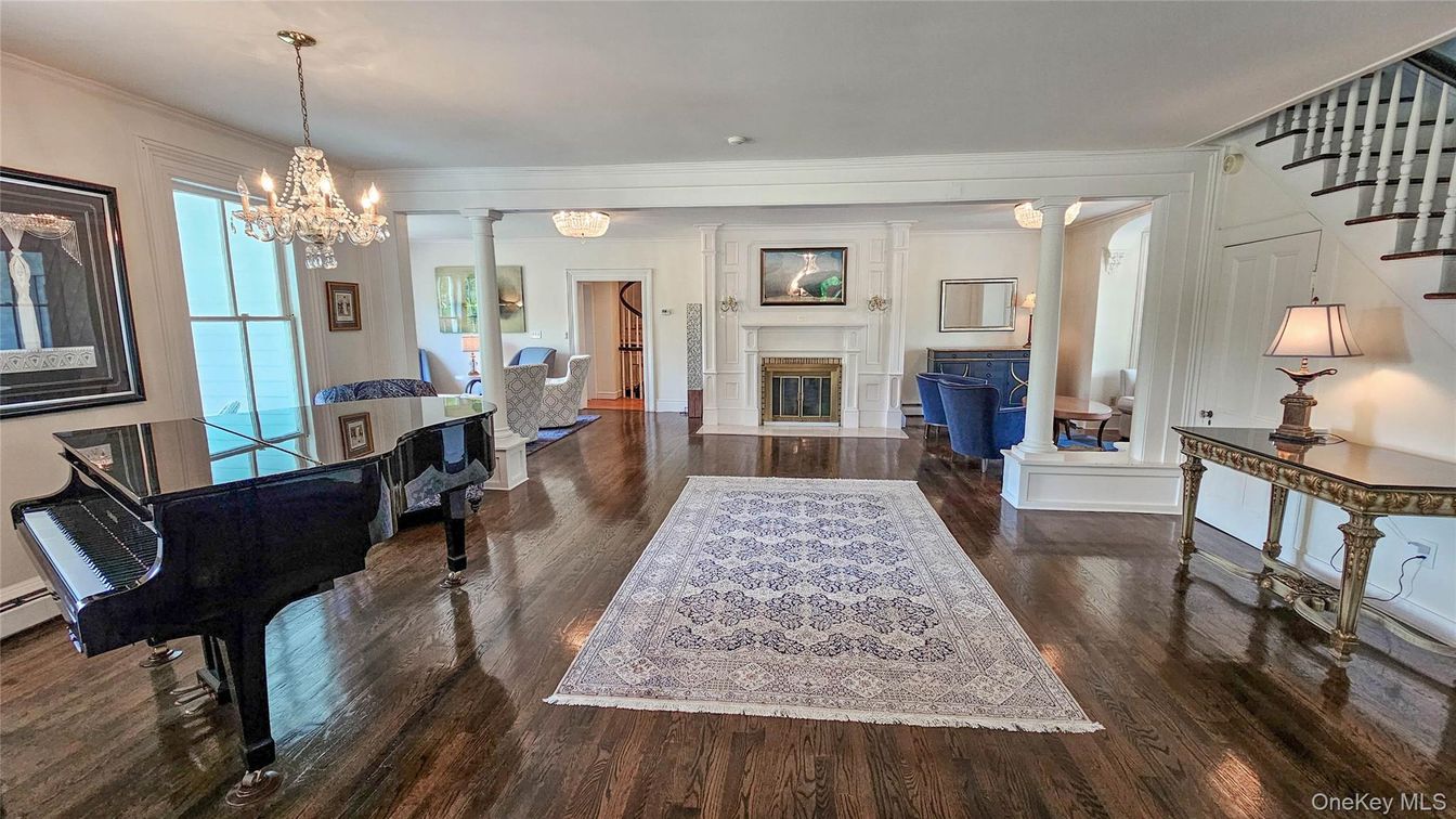 Chandelier, Fireplace, Interior, Living room, Piano, Recessed Lighting, Wood Texture Flooring