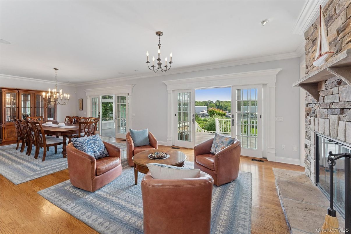 Chandelier, Dining room, Fireplace, Interior, Living room, Stone Walls, Wood Texture Flooring