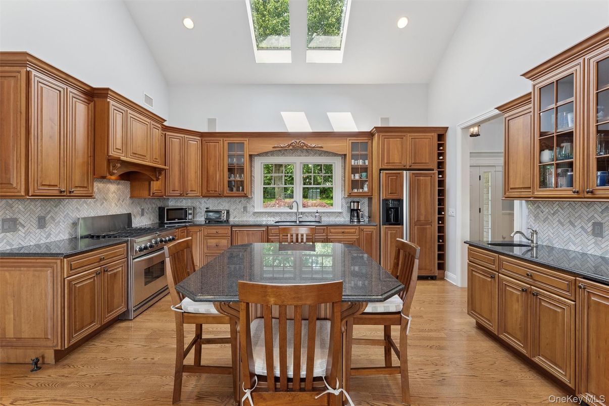 Dining room, Interior, Kitchen, Recessed Lighting, Stainless Steel Appliances, Wood Texture Flooring