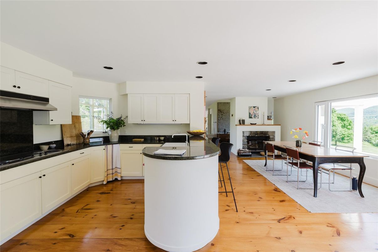 Dining room, Fireplace, Interior, Kitchen, Recessed Lighting, Wood Texture Flooring
