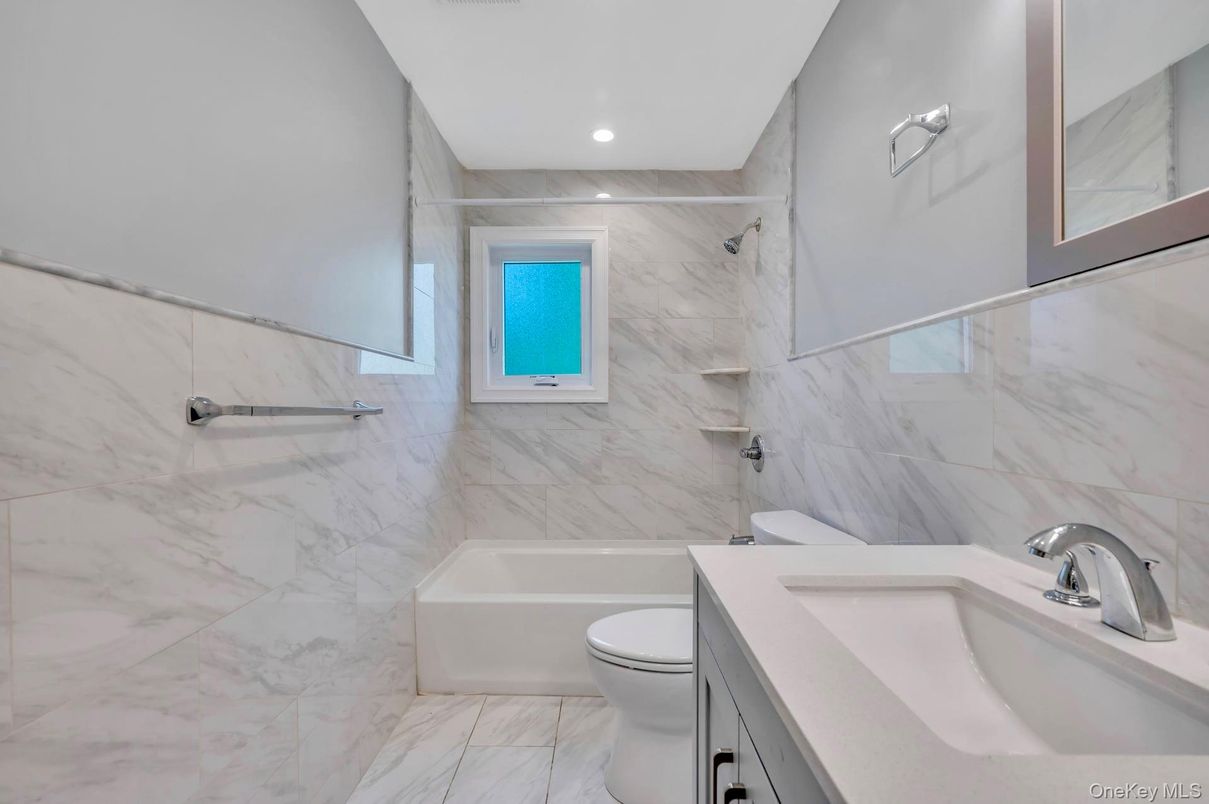Bathroom, Dual Sink Vanities, Interior, Marble, Marble Walls, Recessed Lighting